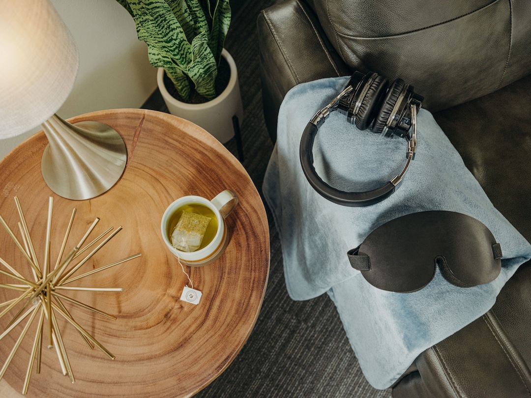 Tea, eye mask, and headphones in treatment room
